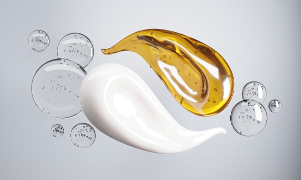 Cream and Essence oil mixed surrounded by warter bubbles on a white background.-3d rendering